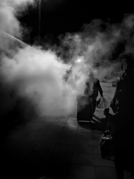 person with bag walking on the street