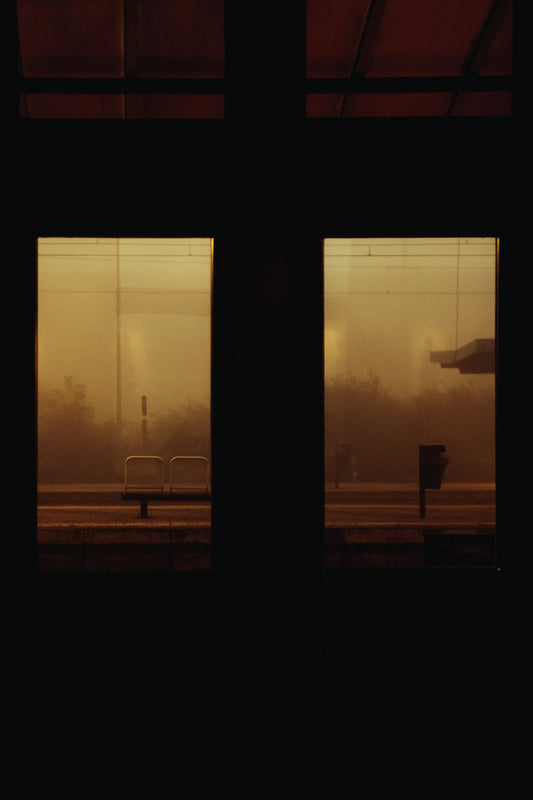 a view of a train station through two windows