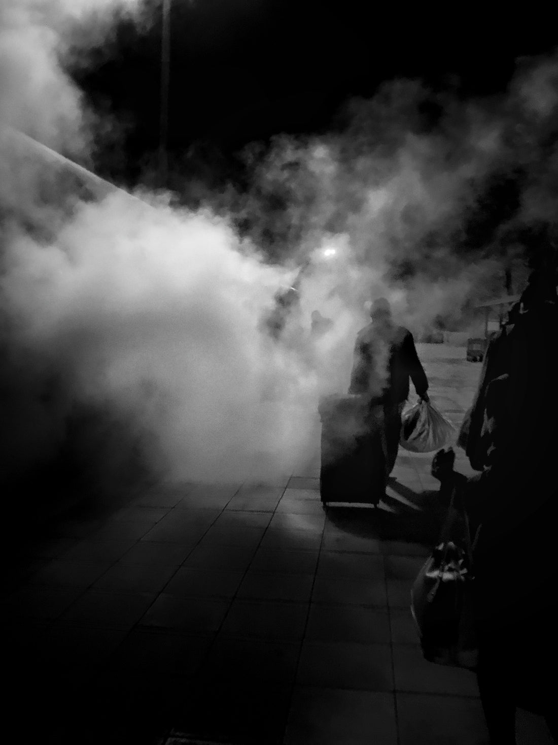 person with bag walking on the street