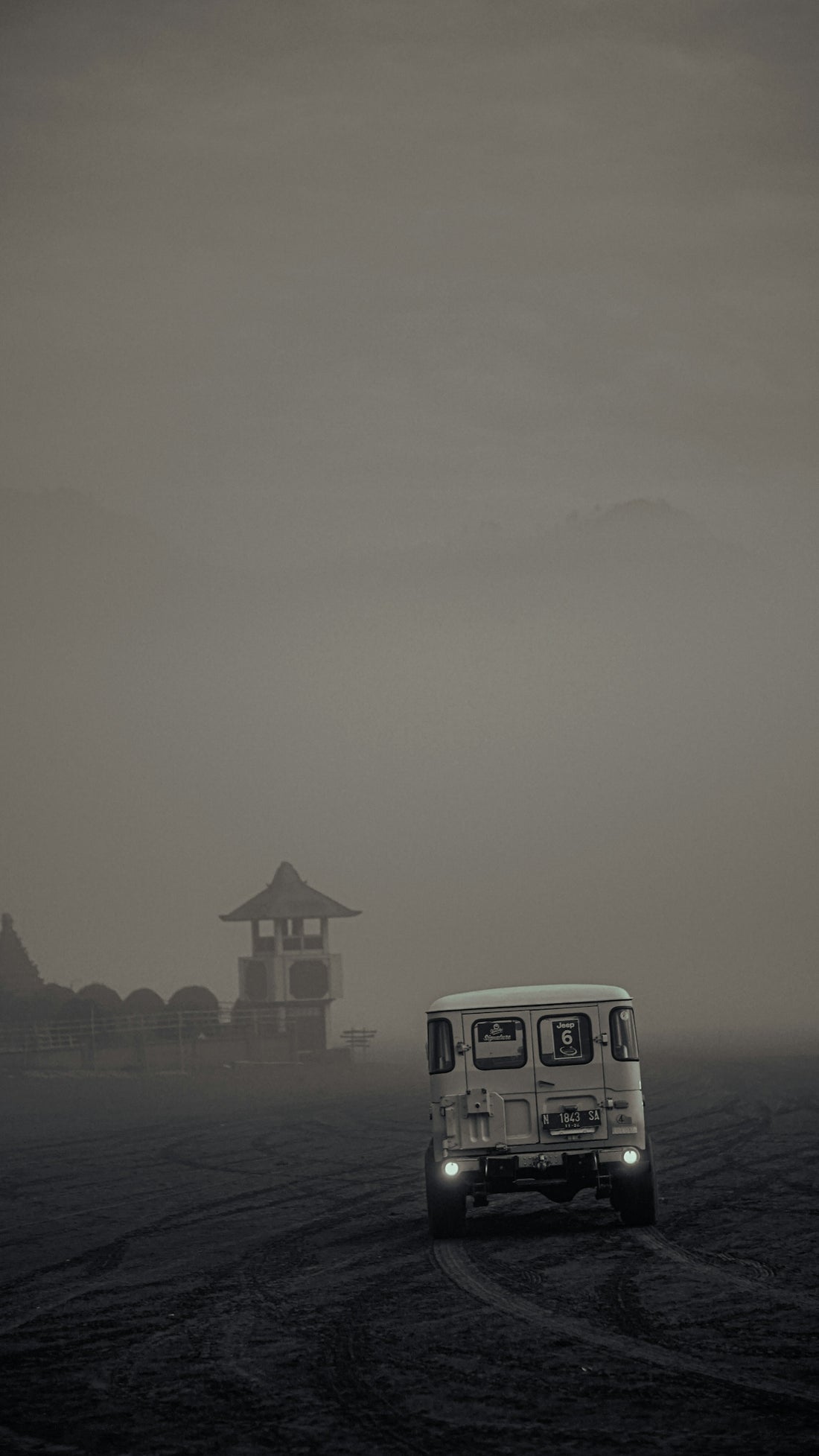 white van on road during foggy weather